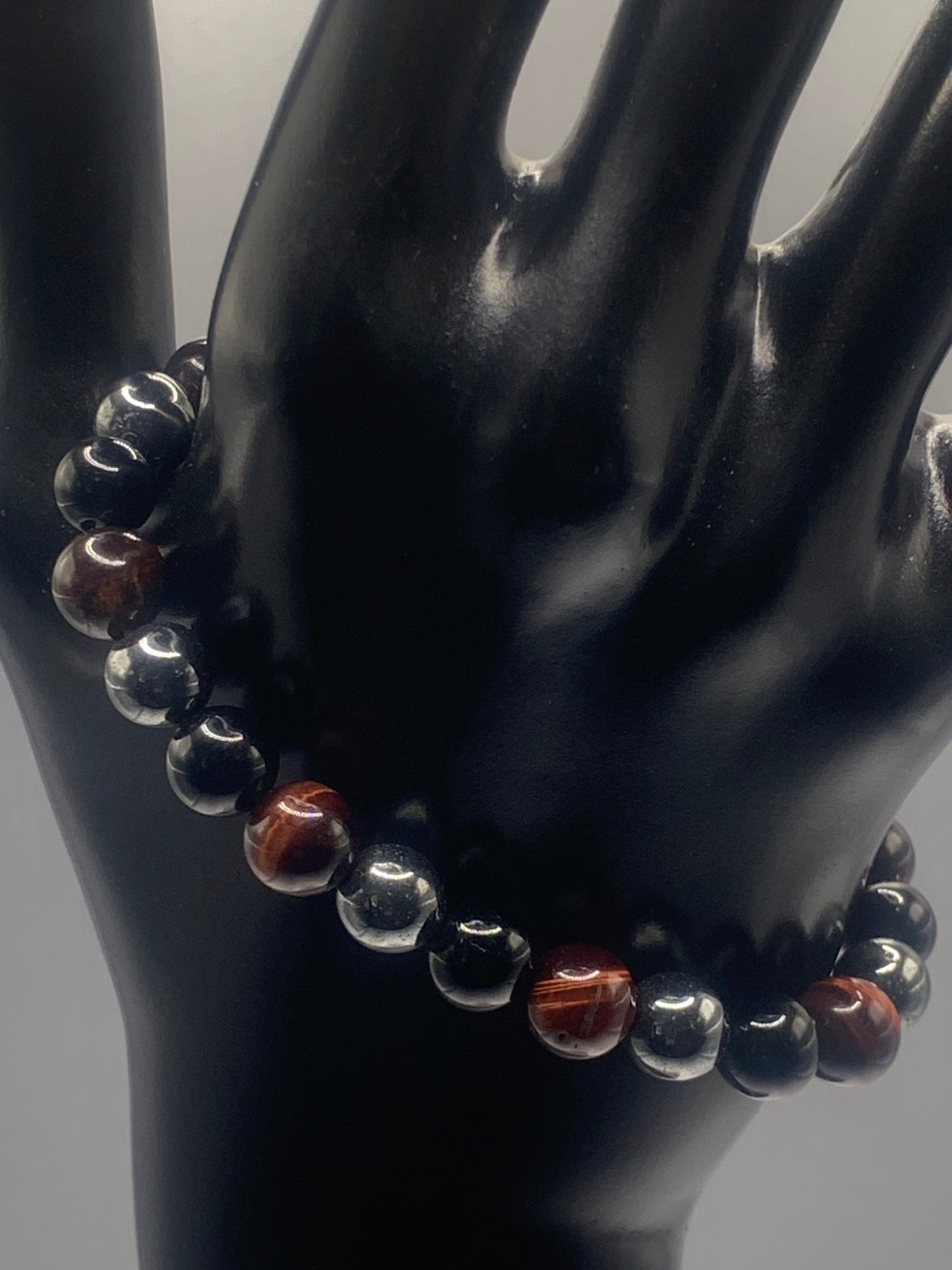 Hematite, black obsidian, and red tigers eye semi precious stone/crystal elastic beaded bracelet