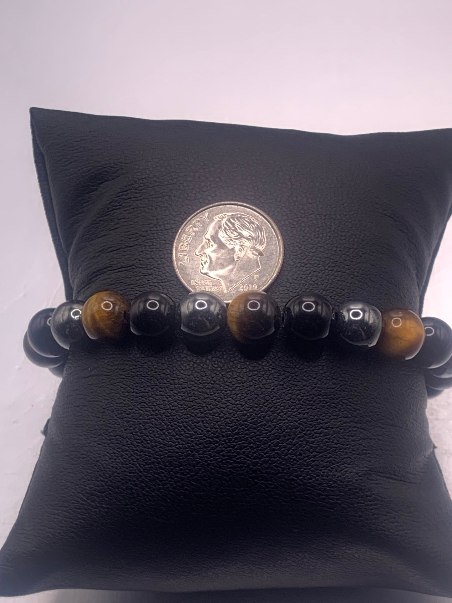 Hematite, black obsidian, and brown tigers eye semi precious stone/crystal elastic beaded bracelet