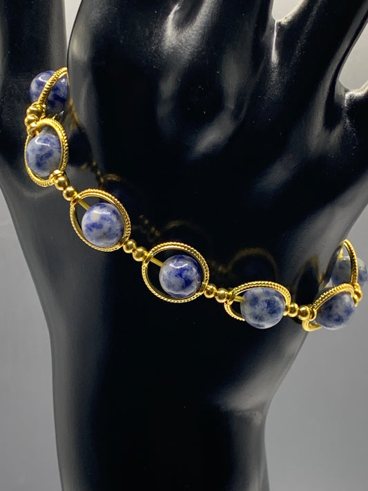 Blue dot jasper semi precious stone/crystal elastic beaded bracelet with gold colored rings
