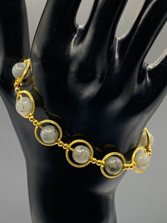 Labradorite semi precious stone/crystal elastic beaded bracelet with gold colored rings