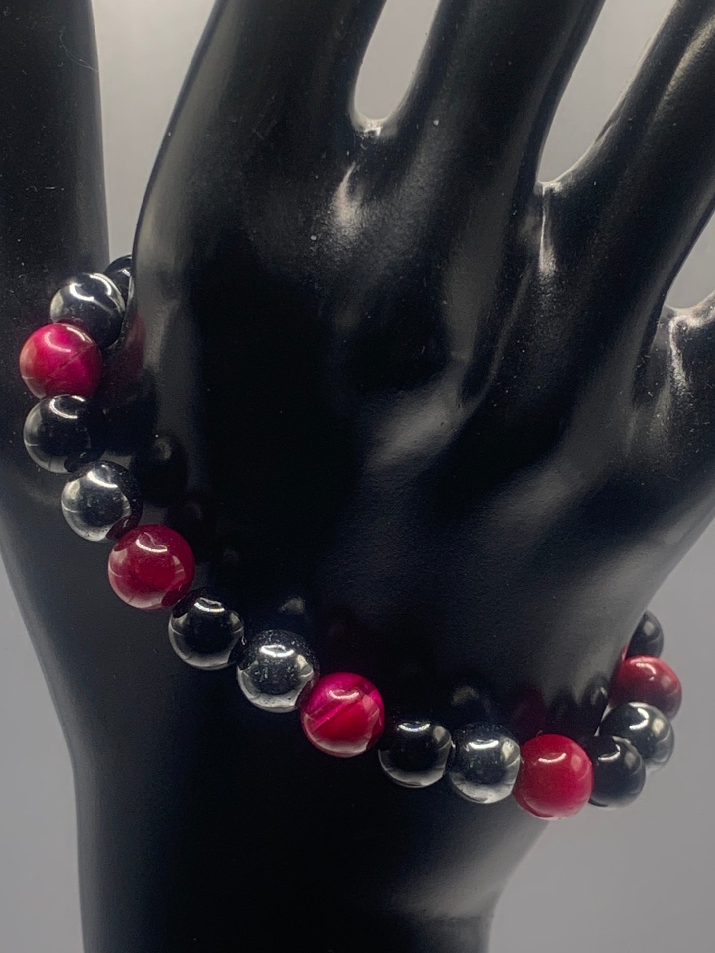 Hematite, black obsidian, and pink tigers eye semi precious stone/crystal elastic beaded bracelet