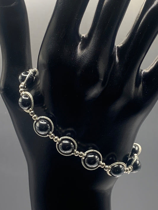 Hematite semi precious stone/crystal elastic beaded bracelet with silver colored rings
