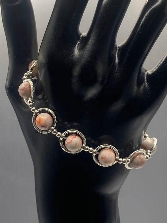 Red vein jasper semi precious stone/crystal elastic beaded bracelet with silver colored rings