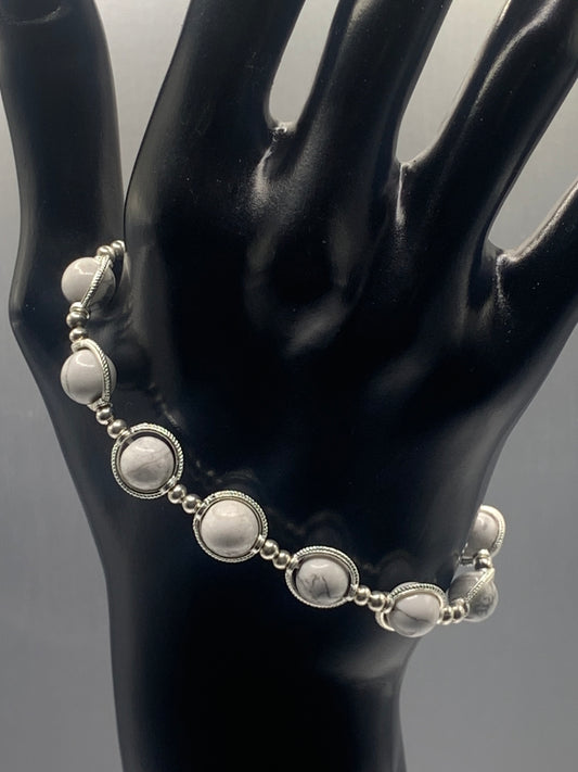 Howlite semi precious stone/crystal elastic beaded bracelet with silver colored rings