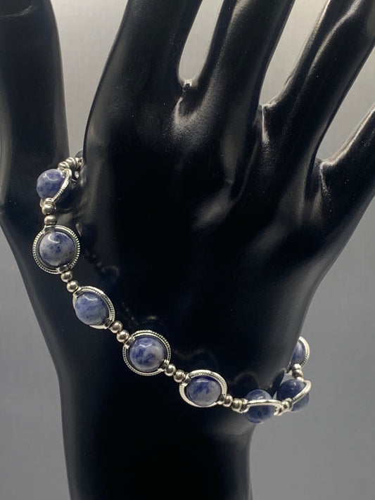 Blue dot jasper semi precious stone/crystal elastic beaded bracelet with silver colored rings