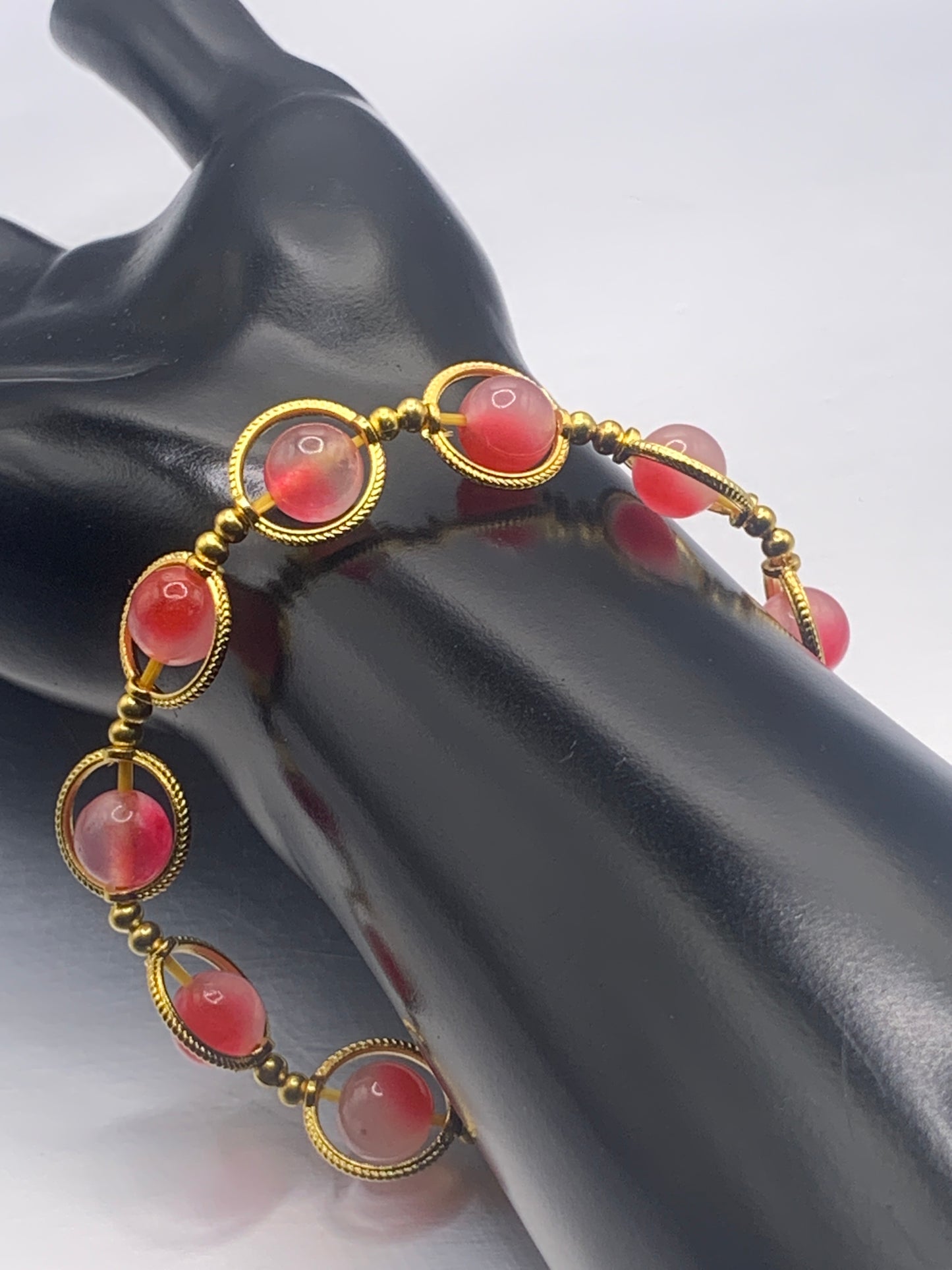 Hot pink agate semi precious stone/crystal elastic beaded bracelet with gold colored rings