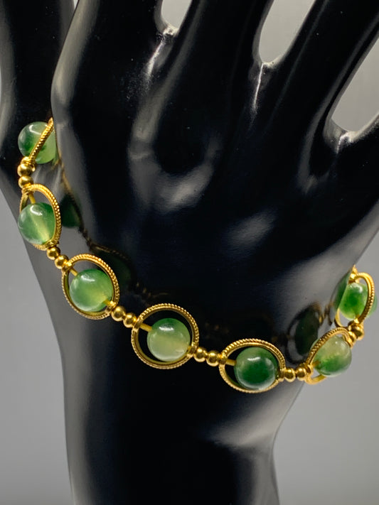 Green agate semi precious stone/crystal elastic beaded bracelet with gold colored rings