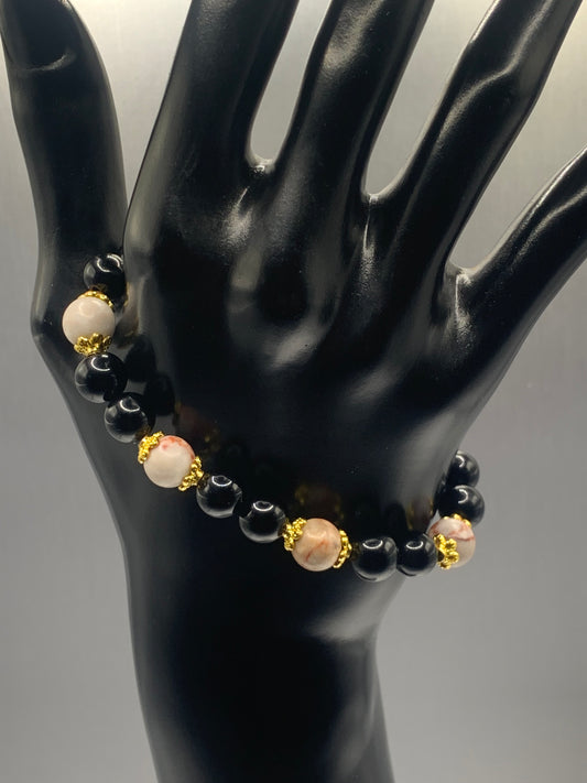 Red vein jasper and black obsidian semi precious stone/crystal elastic beaded bracelet with gold plated flower bead caps