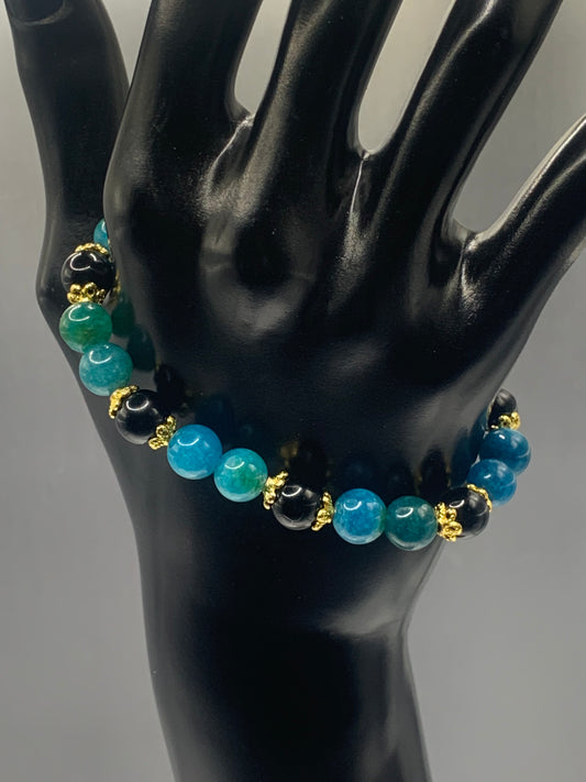Black obsidian with blue apatite semi precious stone/crystal beaded elastic bracelet with gold plated flower bead caps