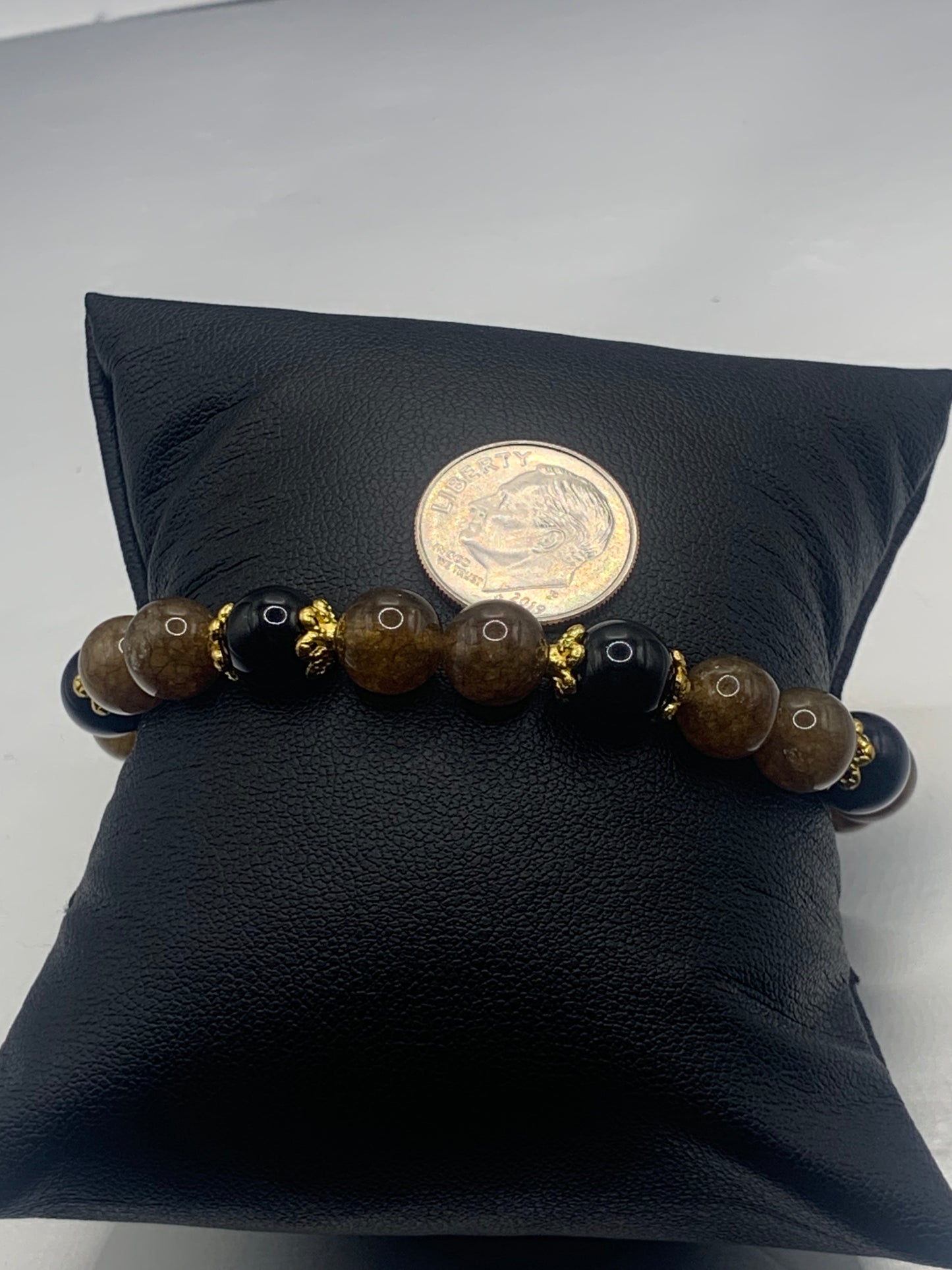 Black obsidian with brown tourmaline semi precious stone/crystal beaded elastic bracelet with gold plated flower bead caps