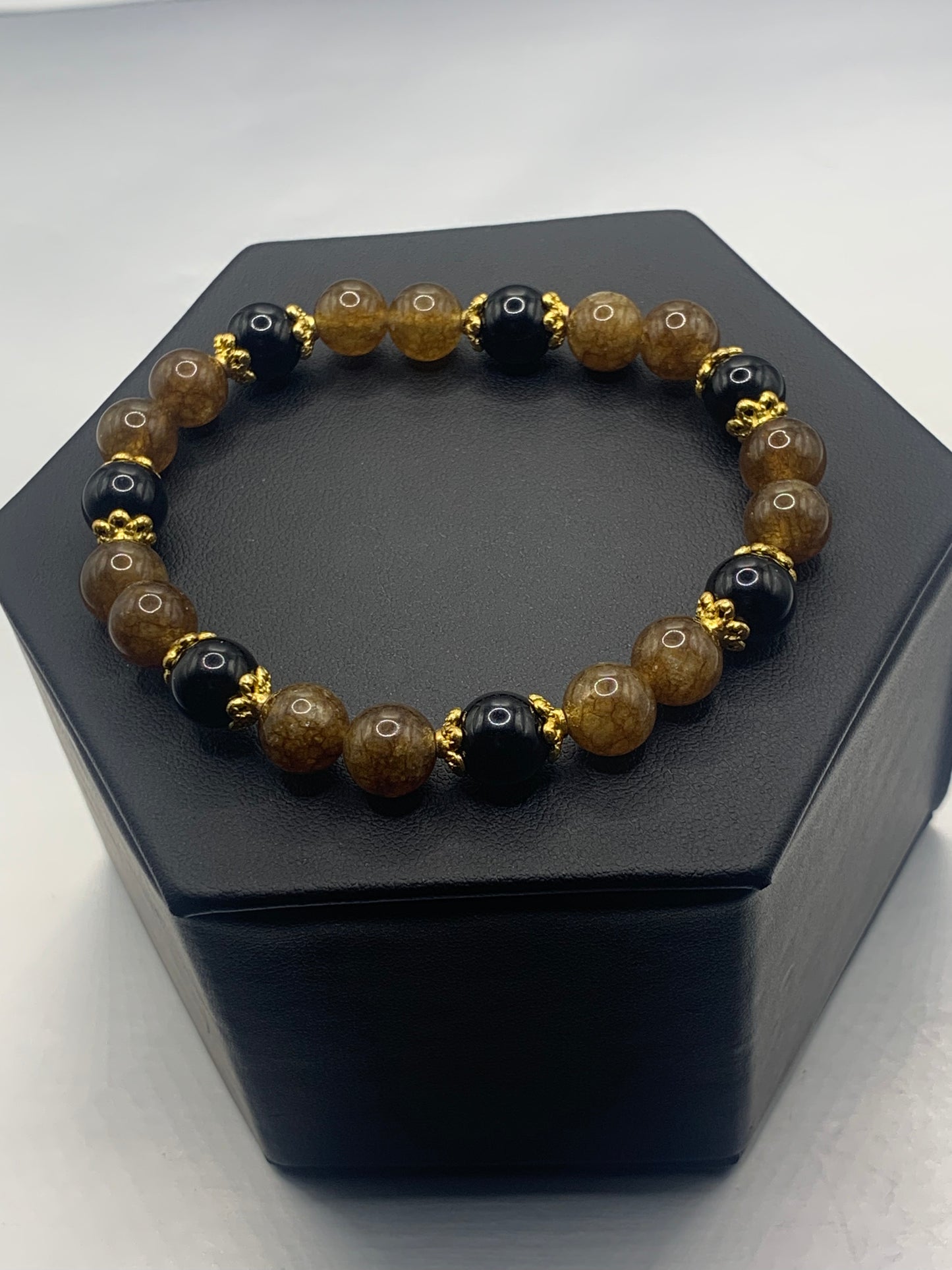Black obsidian with brown tourmaline semi precious stone/crystal beaded elastic bracelet with gold plated flower bead caps