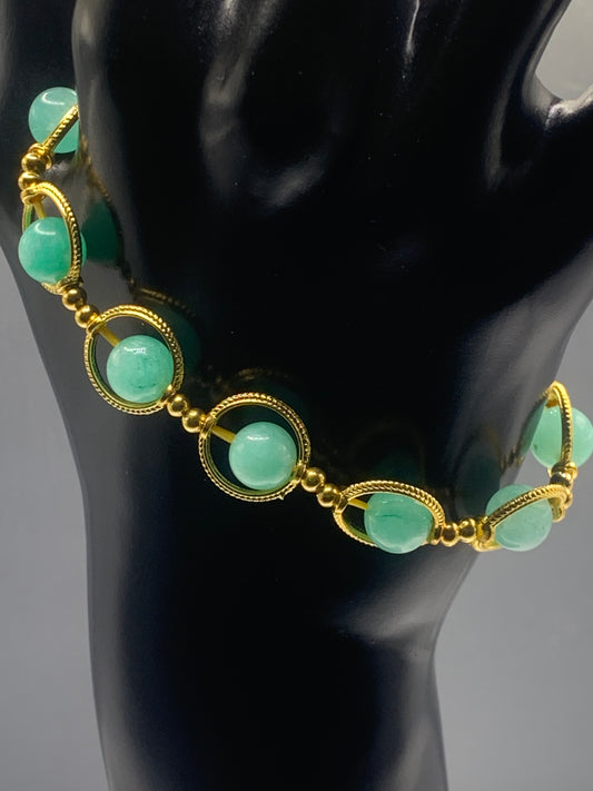 Teal chalcedony semi precious stone/crystal elastic beaded bracelet with gold colored rings