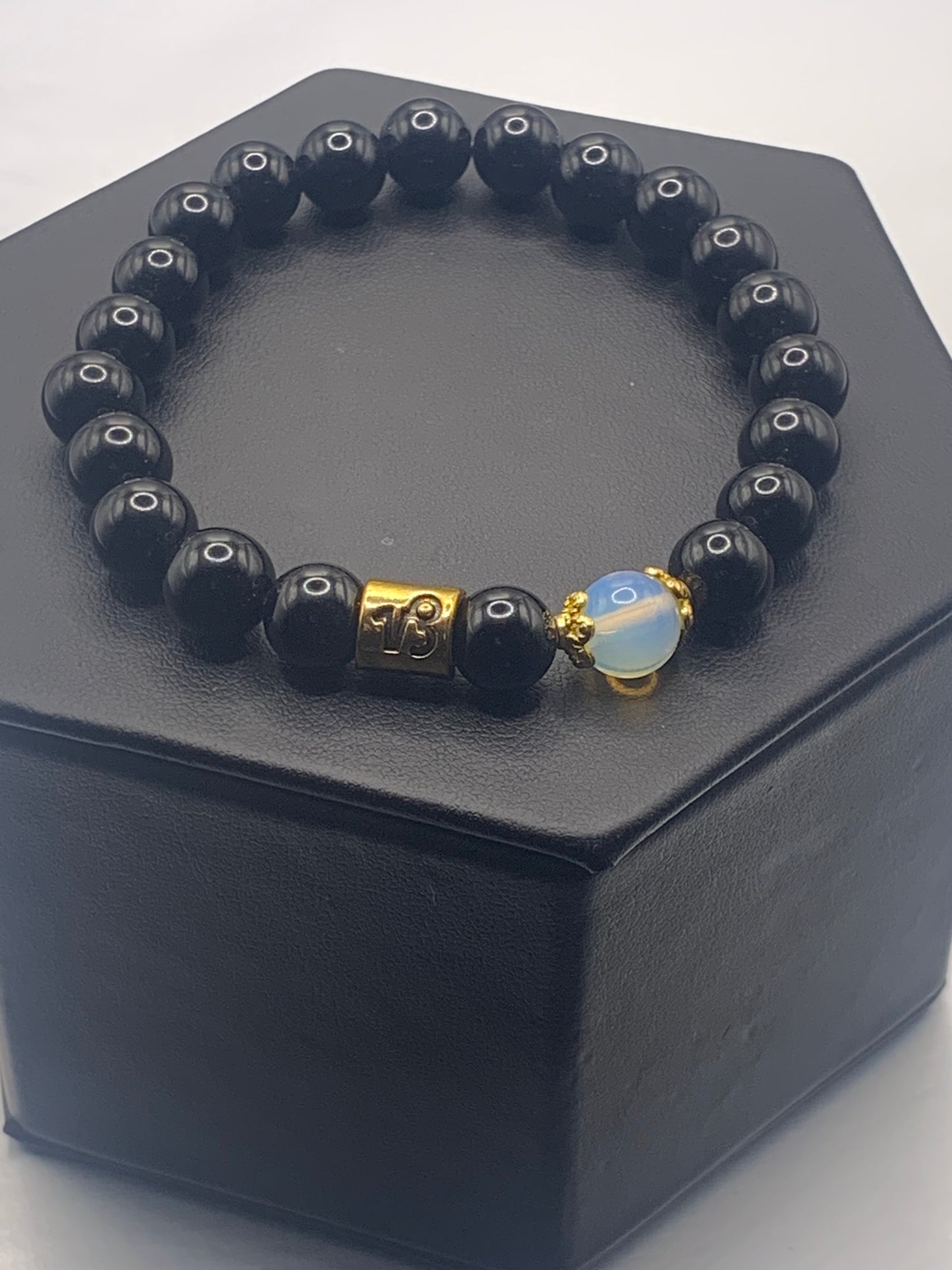 Capricorn Zodiac black obsidian with opalite elastic beaded bracelet with gold accents