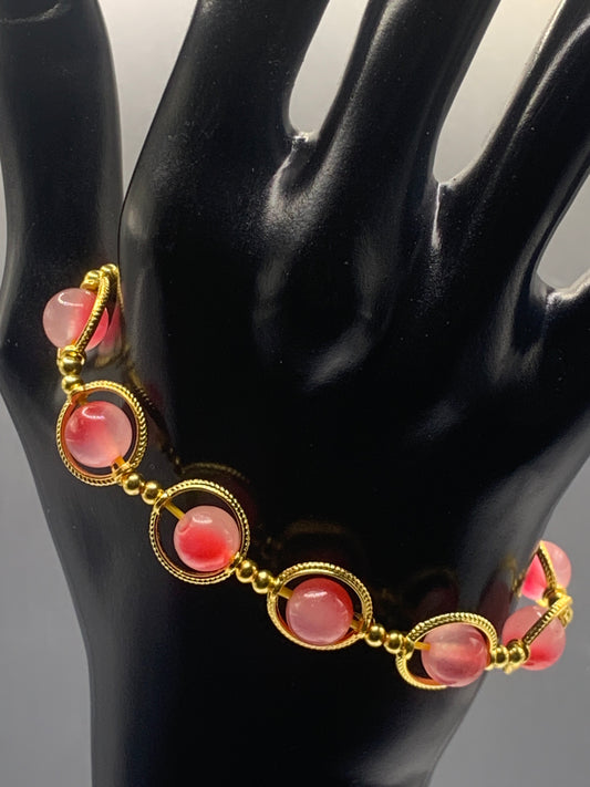 Hot pink agate semi precious stone/crystal elastic beaded bracelet with gold colored rings