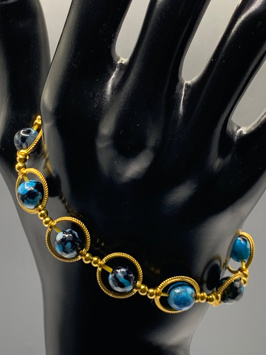 Blue orca agate semi precious stone/crystal elastic beaded bracelet with gold colored rings