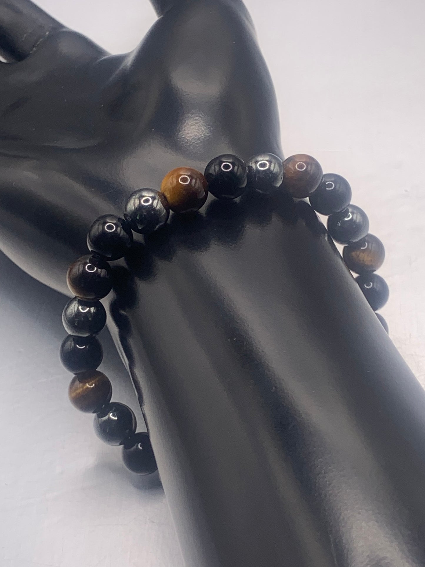 Hematite, black obsidian, and brown tigers eye semi precious stone/crystal elastic beaded bracelet