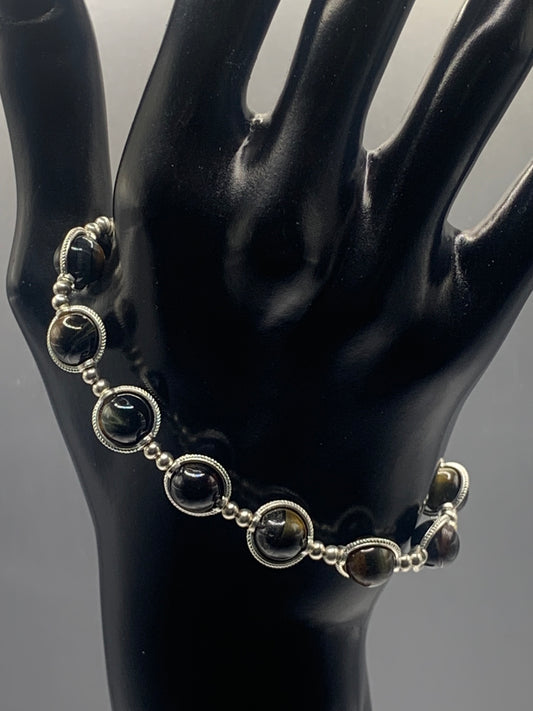 Tigers eye semi precious stone/crystal elastic beaded bracelet with silver colored rings