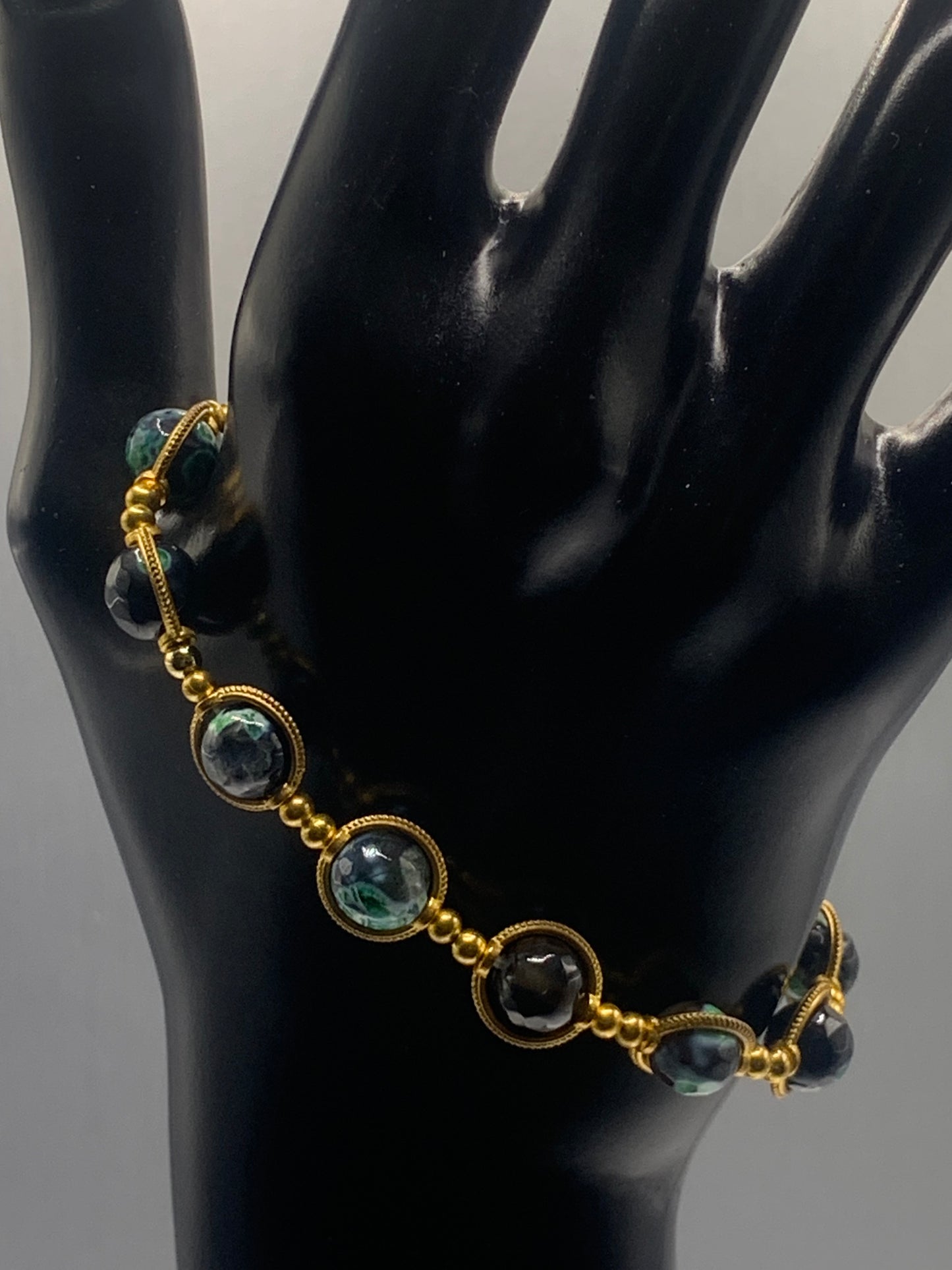 Green orca agate semi precious stone/crystal elastic beaded bracelet with gold colored rings
