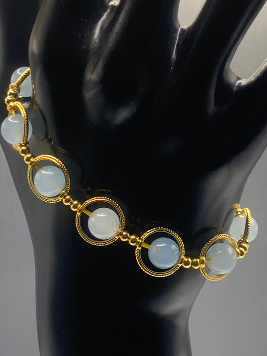 Blue agate semi precious stone/crystal elastic beaded bracelet with gold colored rings