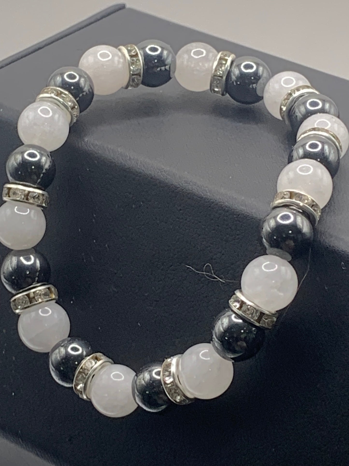 Hematite and white chalcedony semi precious stone/crystal elastic beaded bracelet with clear rondelle's