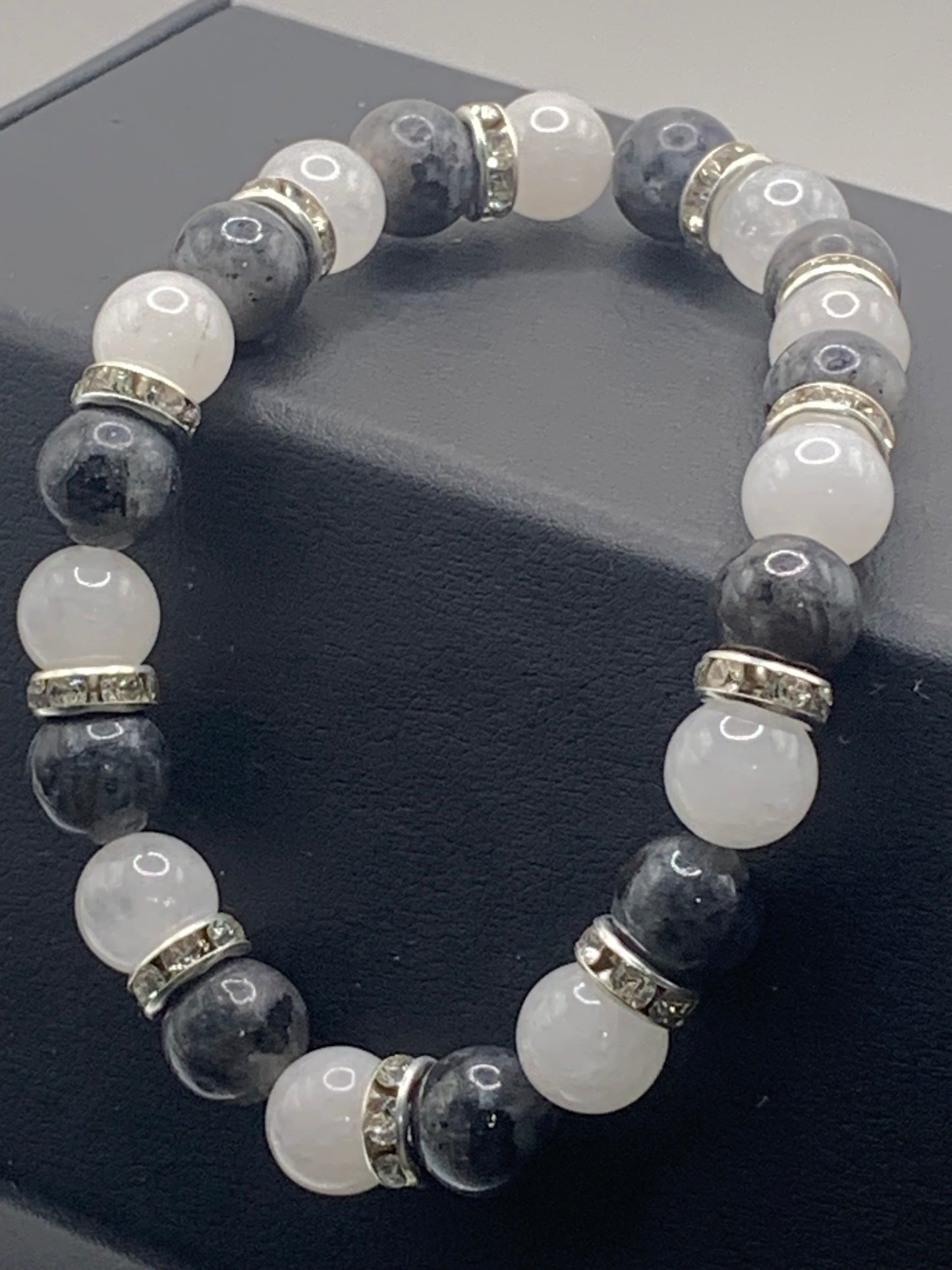 Larvikite and white chalcedony semi precious stone/crystal elastic beaded bracelet with clear rondelle's