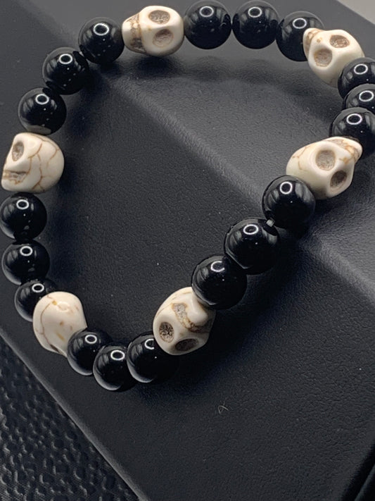 Black obsidian semi precious stone/crystal elastic beaded bracelet with white resin skulls