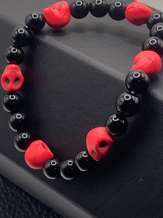 Black obsidian semi precious stone/crystal elastic beaded bracelet with pink resin skulls