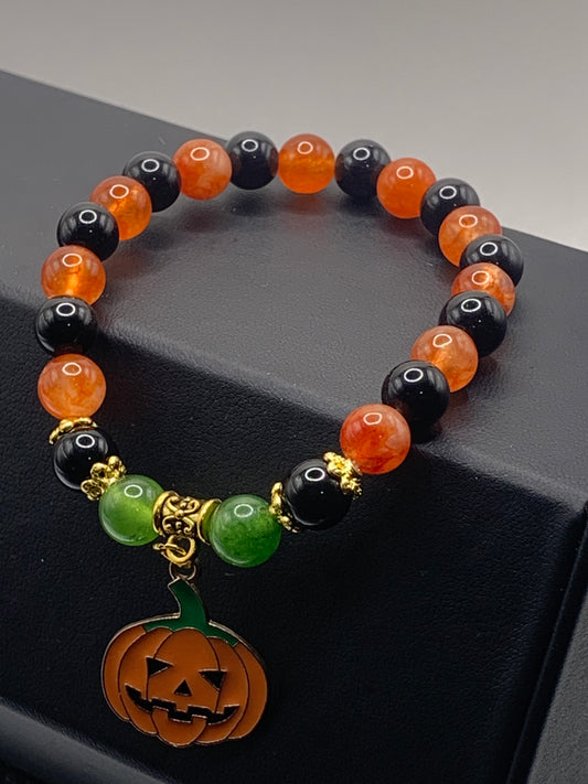 Phoenix agate, green chalcedony, and black obsidian semi precious stone/crystal elastic beaded bracelet with Halloween charm
