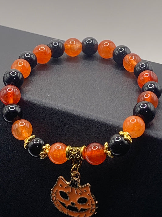 Phoenix agate, and black obsidian semi precious stone/crystal elastic beaded bracelet with Halloween charm