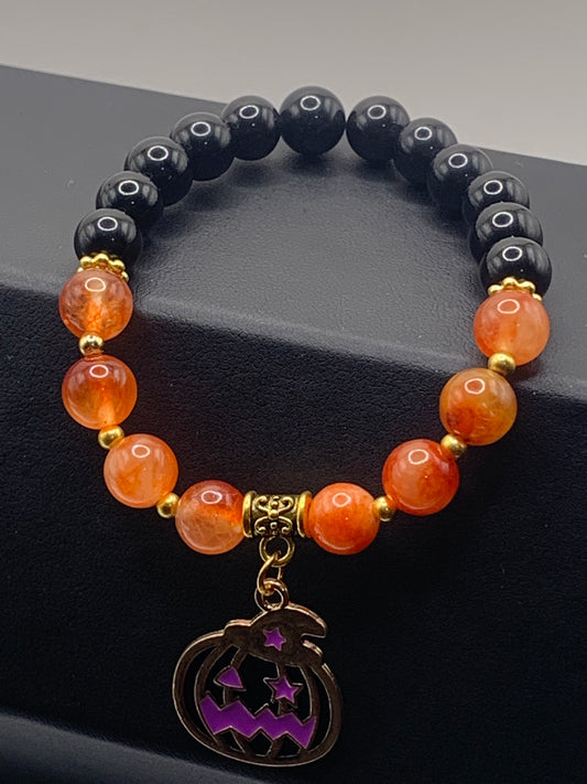 Black obsidian and phoenix agate semi precious stone/crystal elastic beaded bracelet with Halloween charm