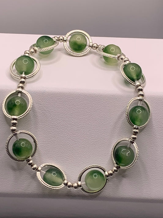 Green chalcedony semi precious stone/crystal elastic beaded bracelet with silver colored rings
