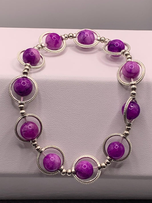 Purple charoite semi precious stone/crystal elastic beaded bracelet with silver colored rings
