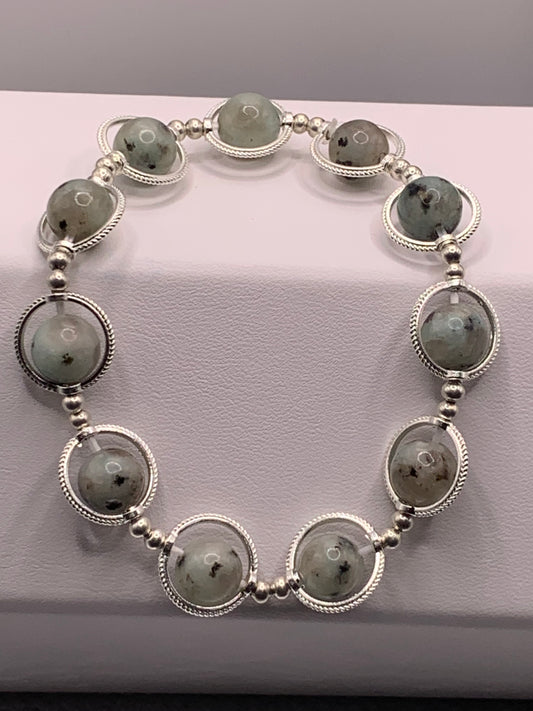 Kiwi jasper semi precious stone/crystal elastic beaded bracelet with silver colored rings