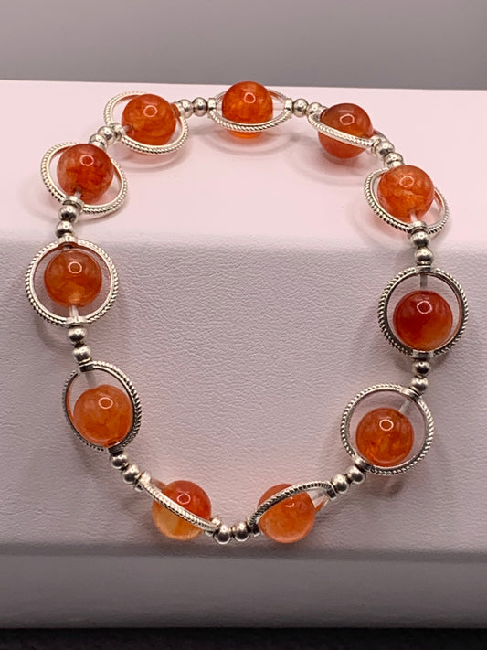 Phoenix agate semi precious stone/crystal elastic beaded bracelet with silver colored rings