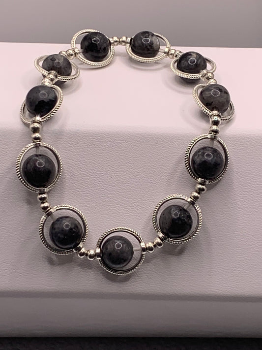 Larvikite semi precious stone/crystal elastic beaded bracelet with silver colored rings