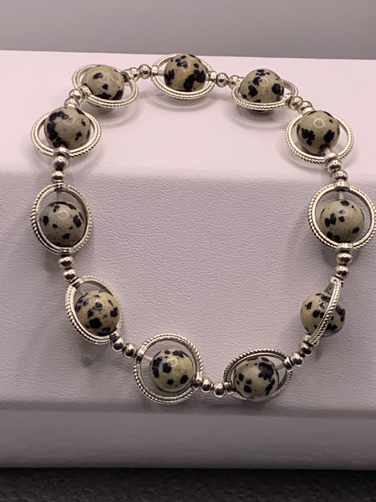 Dalmatian jasper semi precious stone/crystal elastic beaded bracelet with silver colored rings