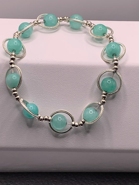 Teal chalcedony semi precious stone/crystal elastic beaded bracelet with silver colored rings