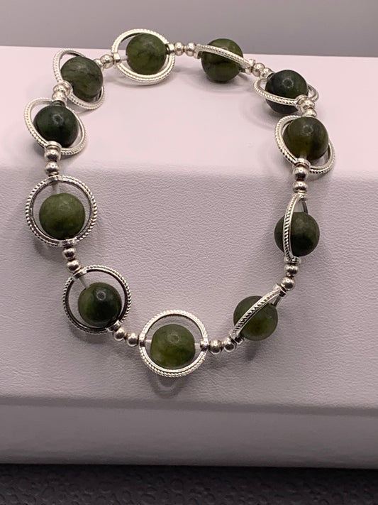 Green jade semi precious stone/crystal elastic beaded bracelet with silver colored rings