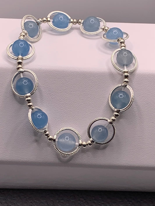 Blue agate semi precious stone/crystal elastic beaded bracelet with silver colored rings