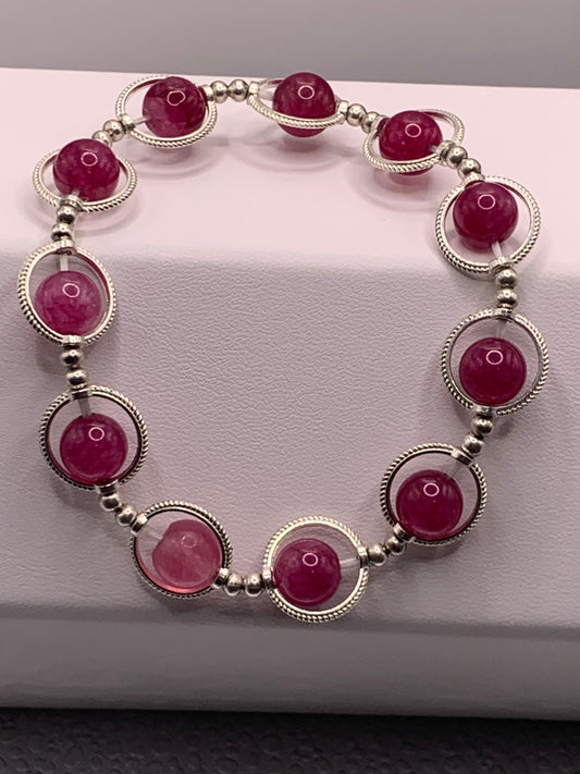 Dark pink chalcedony semi precious stone/crystal elastic beaded bracelet with silver colored rings