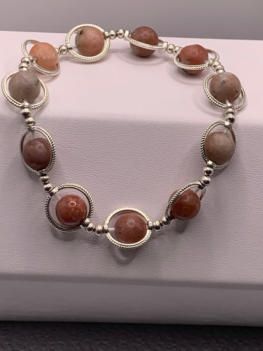 Pink lepidolite semi precious stone/crystal elastic beaded bracelet with silver colored rings
