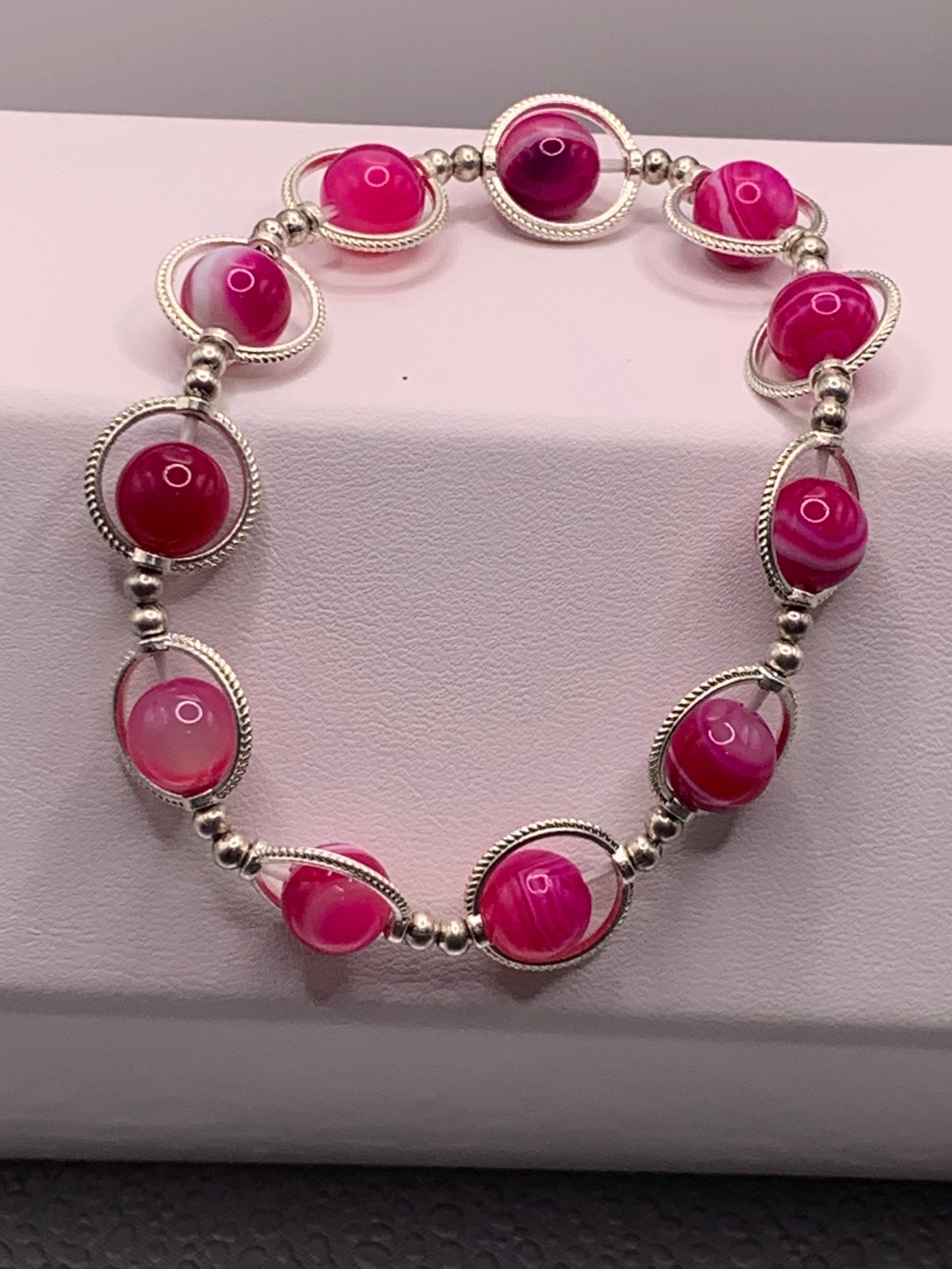 Pink lace agate semi precious stone/crystal elastic beaded bracelet with silver colored rings