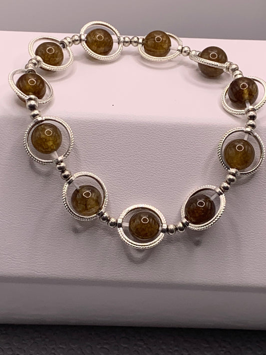 Brown tourmaline semi precious stone/crystal elastic beaded bracelet with silver colored rings