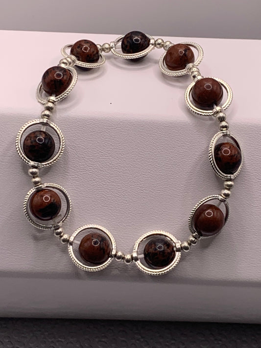 Mahogany jasper semi precious stone/crystal elastic beaded bracelet with silver colored rings