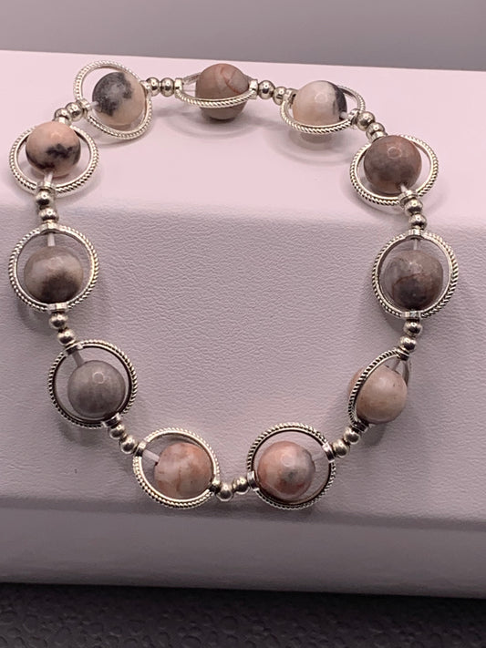 Pink zebra jasper semi precious stone/crystal elastic beaded bracelet with silver colored rings