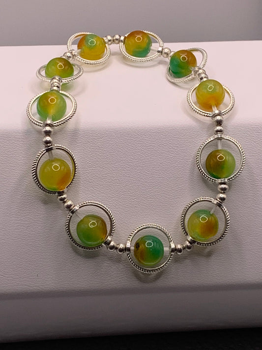 Yellow green chalcedony semi precious stone/crystal elastic beaded bracelet with silver colored rings