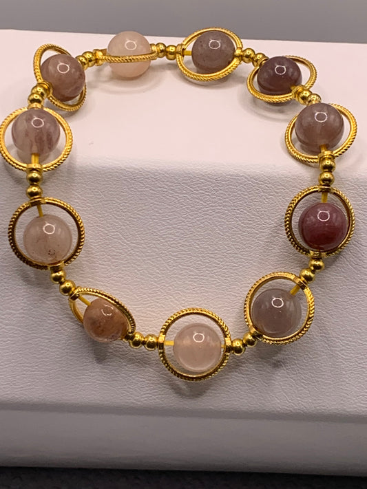 Violet quartz semi precious stone/crystal elastic beaded bracelet with gold colored rings
