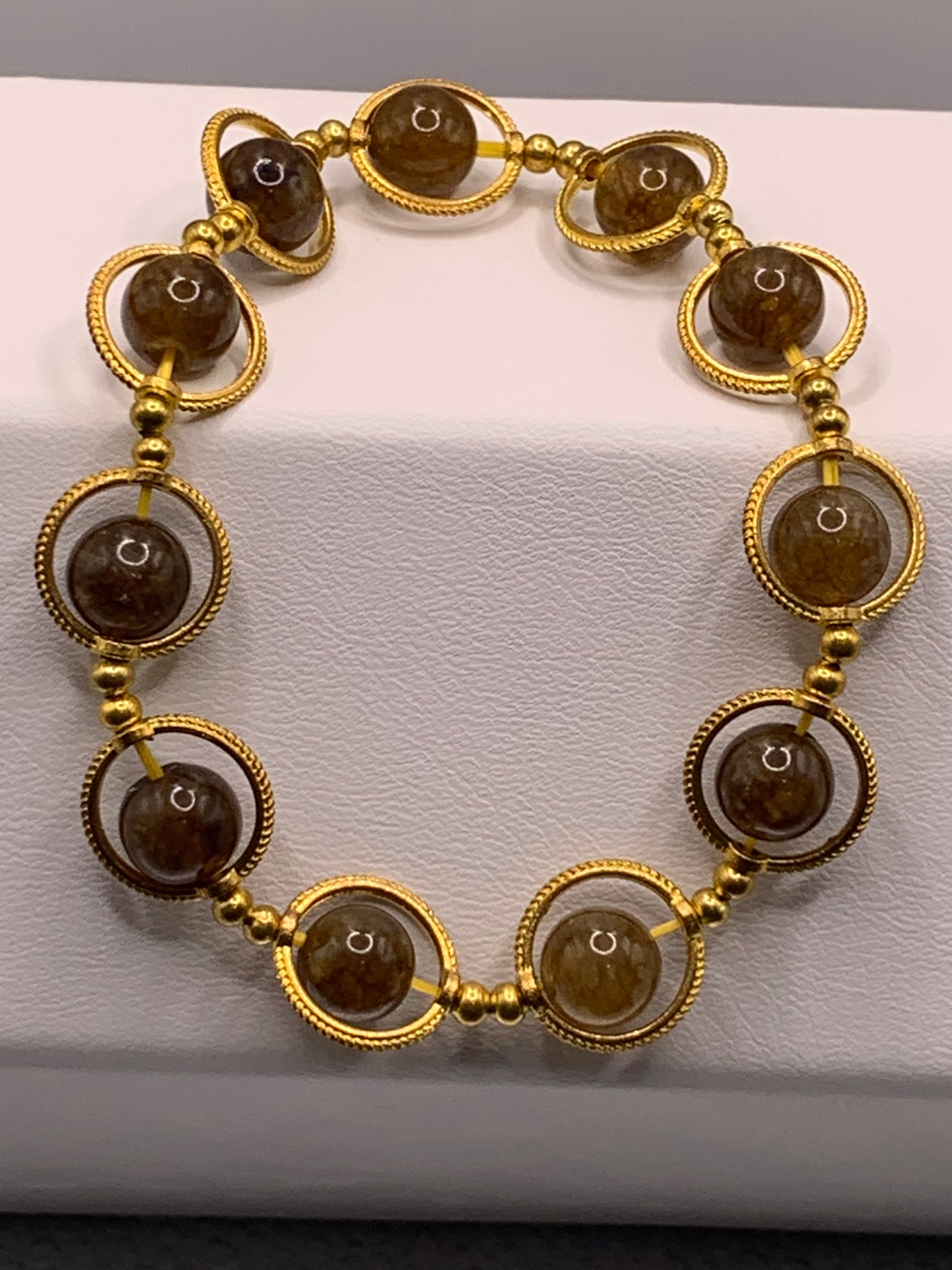 Brown tourmaline semi precious stone/crystal elastic beaded bracelet with gold colored rings