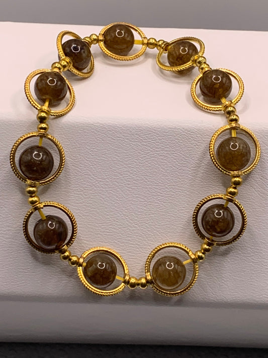 Brown tourmaline semi precious stone/crystal elastic beaded bracelet with gold colored rings