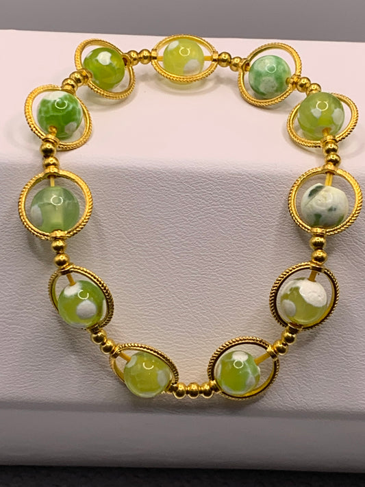 Yellow green white orca agate semi precious stone/crystal elastic beaded bracelet with gold colored rings